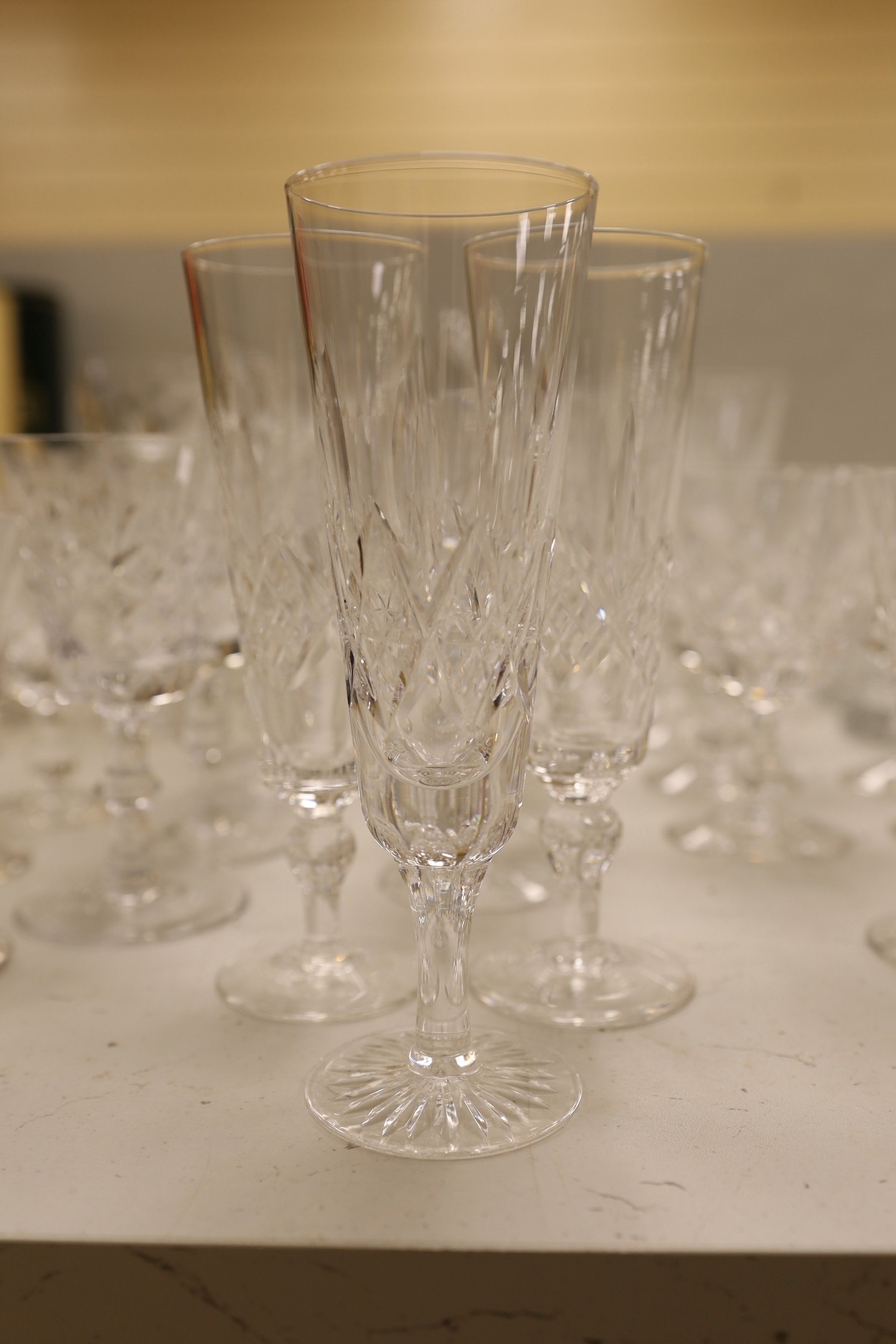 A large collection of suites of mostly Stuart cut glass, including, wine glasses, spirits glasses and jugs